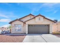 Charming single-story home with a two-car garage and low maintenance desert landscaping in a sunny setting at 4137 Buffalo Bill Ave, Las Vegas, NV 89110