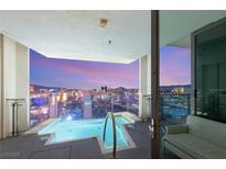Balcony pool overlooking city with glass railings and seating; enjoy luxurious views from your own private oasis at 4381 W Flamingo Rd # 57306, Las Vegas, NV 89103