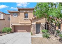 Inviting two-story home with stone accents, desert landscaping, and a spacious two-car garage at 8716 Brilliant Star Dr, Las Vegas, NV 89178