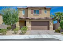 Charming two-story home featuring a well-manicured front yard and inviting curb appeal at 9990 Perth Ct, Las Vegas, NV 89141