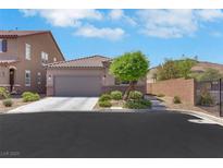 Charming single-story home featuring a well-maintained yard and attached two-car garage at 703 Shiva St, Las Vegas, NV 89178