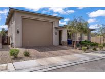 Charming single-story home featuring a two-car garage, desert landscaping, and a welcoming front porch at 789 Goodman Cove St, Henderson, NV 89011