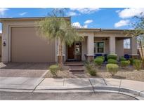 Charming single story home featuring a well-maintained landscaped yard and covered porch at 789 Goodman Cove St, Henderson, NV 89011