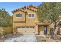 Two-story home with an attached two-car garage and a well-manicured front yard at 9651 Bouncing Ball St, Las Vegas, NV 89178