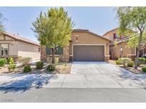 Charming single-story home featuring a stone facade and a well-maintained front yard with mature landscaping at 7137 Flowering Rose Ave, Las Vegas, NV 89117