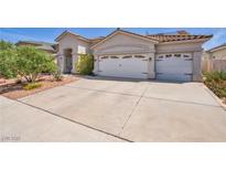 Charming single-story home with a spacious three-car garage and well-maintained front yard at 90 Ancient Hills Ln, Henderson, NV 89074
