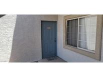 Exterior shot of the unit's front door and window showcasing the building's architecture at 3318 N Decatur Blvd # 1002, Las Vegas, NV 89130
