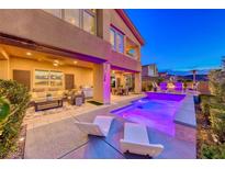 Inviting outdoor pool area with modern lounge chairs and covered patio seating at 7 Hilltop Crest St, Henderson, NV 89011