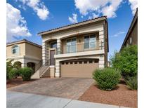 Charming two-story home featuring a front-facing balcony and a well-maintained, stylish brick driveway at 8276 Sorrel St, Las Vegas, NV 89139