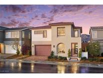 Beautiful two-story home featuring a modern design, red brick driveway, and desert landscaping at 1208 Crimson Sunbird St, North Las Vegas, NV 89084