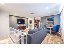 Inviting living room with modern furnishings, wood floors and a flatscreen TV at 1553 Dorothy Ave # 4, Las Vegas, NV 89119