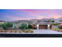 Stunning single-story home featuring a tiled roof, desert landscaping and a two car garage at 21 Grand Masters Dr, Las Vegas, NV 89141