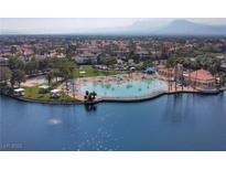 Beautiful community pool and recreational area surrounded by palm trees and lush landscaping at 2416 Sun Shores Dr, Las Vegas, NV 89128