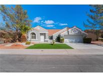 Charming single-story home featuring a well-manicured lawn and desert landscaping at 2528 Sunup Dr, Las Vegas, NV 89134