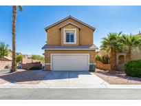 Charming two-story home featuring a neutral stucco finish, desert landscaping, and a convenient two-car garage at 2608 Los Palos St, Las Vegas, NV 89108