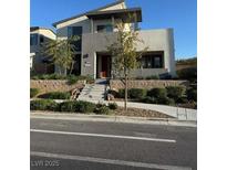 Contemporary two-story home featuring a modern design and well-maintained front yard at 3216 Waterstone Ave, Henderson, NV 89044