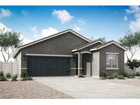 Charming single-story home features a neutral color palette and a spacious two-car garage at 3225 Walker River St, North Las Vegas, NV 89032