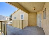Inviting exterior featuring a secure gated patio, offering privacy and a welcoming entrance to the home at 1979 Cutlass Dr # 1979, Henderson, NV 89014