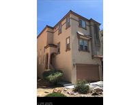 Charming two-story home with a two car garage and landscaped front yard at 6652 Weeping Pine St, Las Vegas, NV 89149