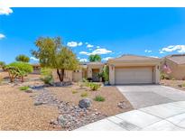 Charming single-story home features desert landscaping, a tile roof, and an attached two-car garage at 1862 Redwood Valley St, Henderson, NV 89052
