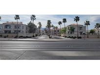 View of the Mar a Lago community entrance lined with palm trees at 3150 Soft Breezes Dr # 1008, Las Vegas, NV 89128