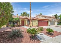 Charming single-story home featuring a well-manicured lawn and a classic red-tiled roof at 731 Rising Star Dr, Henderson, NV 89014