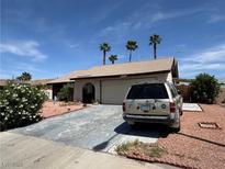 Charming single-story home featuring a desert-landscaped front yard and attached two-car garage at 4244 Gibraltar St, Las Vegas, NV 89121