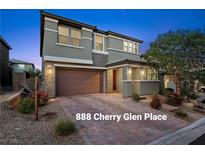 Inviting two-story home featuring a brick driveway, neutral color scheme, and manicured landscaping at 888 Cherry Glen Pl, Las Vegas, NV 89138
