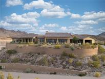 Expansive single-story home with tile roof and private desert landscaping on elevated lot at 1123 Christian Rd, Henderson, NV 89002