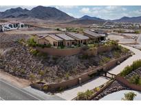 Expansive desert home with stone wall, tiled roof and mountain views at 1123 Christian Rd, Henderson, NV 89002