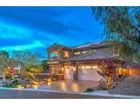 Elegant home featuring three-car garage, tile roof, landscaped yard, and balcony on a corner lot at 2800 Proust Ct, Henderson, NV 89044