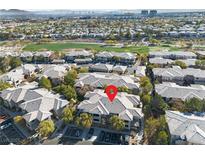 Wonderful aerial view of a property surrounded by lush greenery and fairways in a desirable golf community at 900 Domnus Ln # 102, Las Vegas, NV 89144