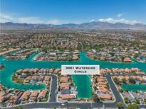 Stunning aerial view of waterfront homes and the community surrounding 3061 Waterside Circle at 3061 Waterside Cir, Las Vegas, NV 89117