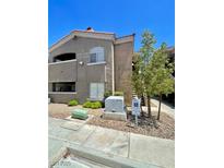 Well maintained two story condo featuring stucco exterior, red tile roof and low maintenance landscaping at 5525 W Flamingo Rd # 2037, Las Vegas, NV 89103