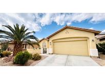 Charming single-story home featuring a two-car garage, desert landscaping, and a well-maintained front yard at 6072 Canter Glen Ave, Las Vegas, NV 89122