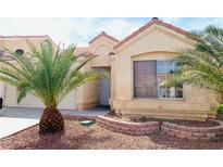 Inviting single-story home featuring desert landscaping and a charming front entrance at 1629 Royal Palm Dr, Las Vegas, NV 89128