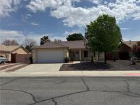 Charming single story home featuring a well maintained yard and convenient two car garage at 228 Hiawatha Way, Mesquite, NV 89027