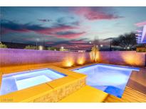 Inviting backyard pool and spa with stunning sunset views and privacy wall at 2832 Aragon Terrace Way, Henderson, NV 89044