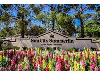 Inviting Sun City Summerlin entrance with colorful flowers in a well maintained Del Webb community at 3116 Richland Dr, Las Vegas, NV 89134