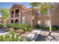 Charming two-story condo features desert landscaping and a private balcony, ideal for relaxing outdoors at 3825 Ormond Beach St # 203, Las Vegas, NV 89129