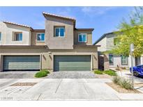 Two-story townhome with a modern design and desert landscaping for low maintenance at 4145 Lunar Canyon Ave, North Las Vegas, NV 89084