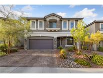 Charming two-story home featuring a well-manicured front yard and a spacious two-car garage at 7058 W Camero Ave, Las Vegas, NV 89113