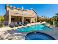 Inviting backyard pool and spa with lounge chairs and covered patio, perfect for outdoor entertaining at 723 Seclusion Glen Ave, Las Vegas, NV 89123