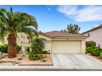 Charming single-story home featuring a well-maintained landscape and attached two-car garage at 7608 Vista Hills Dr, Las Vegas, NV 89128
