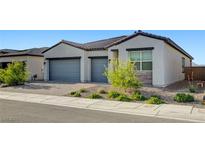 Charming single-story home featuring a two-car garage and drought-tolerant landscaping at 80 Brixton Ave, Henderson, NV 89011
