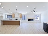 Open-concept kitchen boasts a large island, modern appliances, and ample counter space at 3156 Shadowridge Ave, Las Vegas, NV 89120
