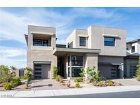 Contemporary two-story home featuring modern design, neutral color palette, and well-maintained landscaping at 10756 Steel Ridge Ct, Las Vegas, NV 89135