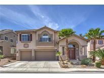 Inviting two-story home with a well-manicured lawn, mature palms, and a spacious three-car garage at 2749 Carolina Blue Ave, Henderson, NV 89052