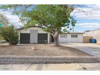 Charming single-story home featuring a well-maintained yard and a covered front porch entrance at 3017 Jamestown Way, Las Vegas, NV 89102