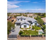 Striking two-story home boasts an open floor plan, a three-car garage, and professionally landscaped grounds at 3458 W Agate Ave, Las Vegas, NV 89139